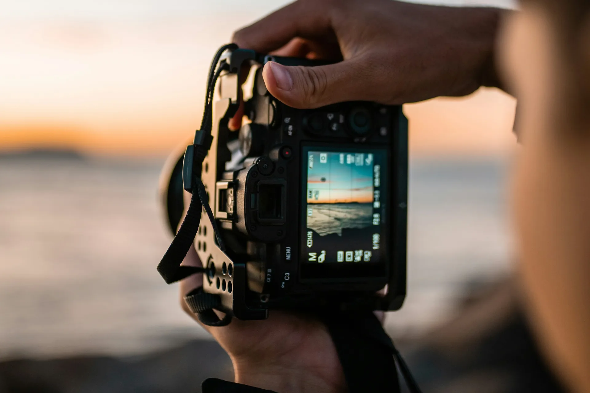 Taking a picture at the water, late in the day